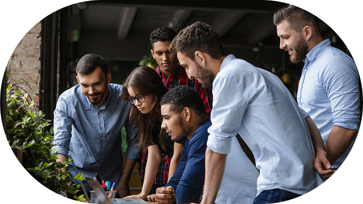 Our team collaborating around a workspace